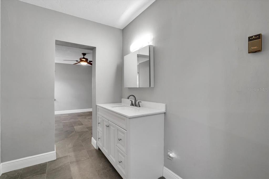2814 47th Street South Gulfport, FL 33711 - Photo 15 of 57 a bathroom with a sink and a mirror