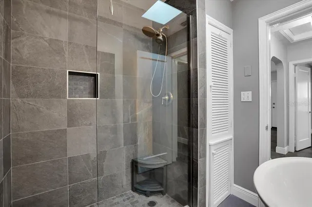 a bathroom with a granite countertop shower