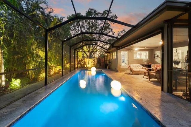 a view of living room with furniture and a floor to ceiling window