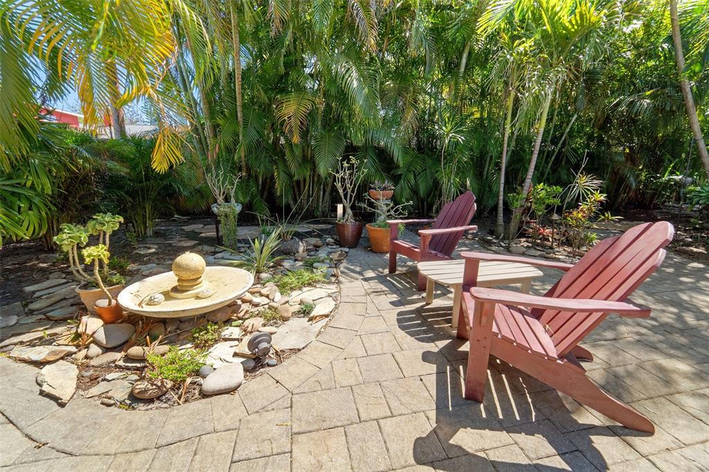2814 47th Street South Gulfport, FL 33711 - Photo 26 of 57 a view of a chairs and table in backyard