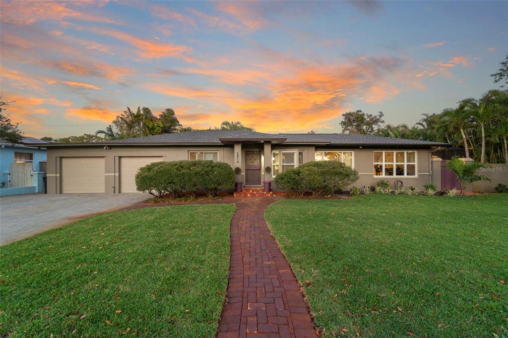 2814 47th Street South Gulfport, FL 33711 - Photo 3 of 57 a view of a house with a yard and potted plants
