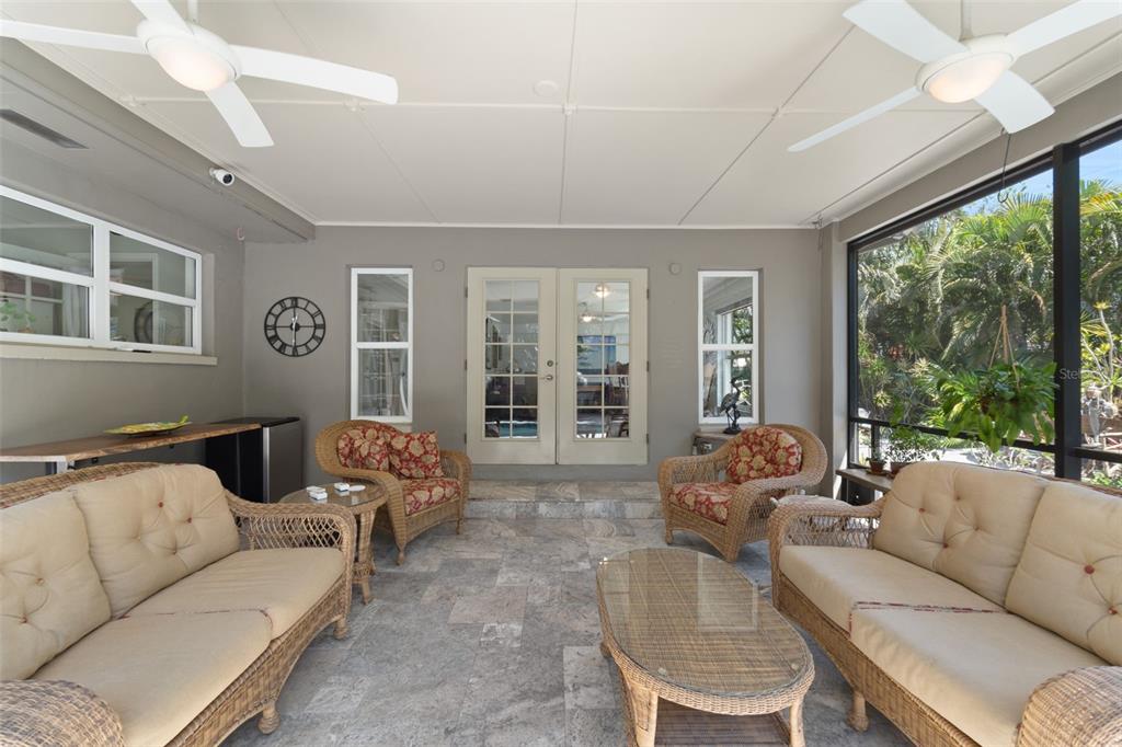 2814 47th Street South Gulfport, FL 33711 - Photo 31 of 57 a living room with furniture and floor to ceiling windows