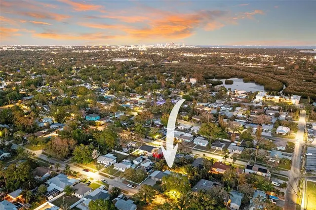 a view of a chair and table in backyard