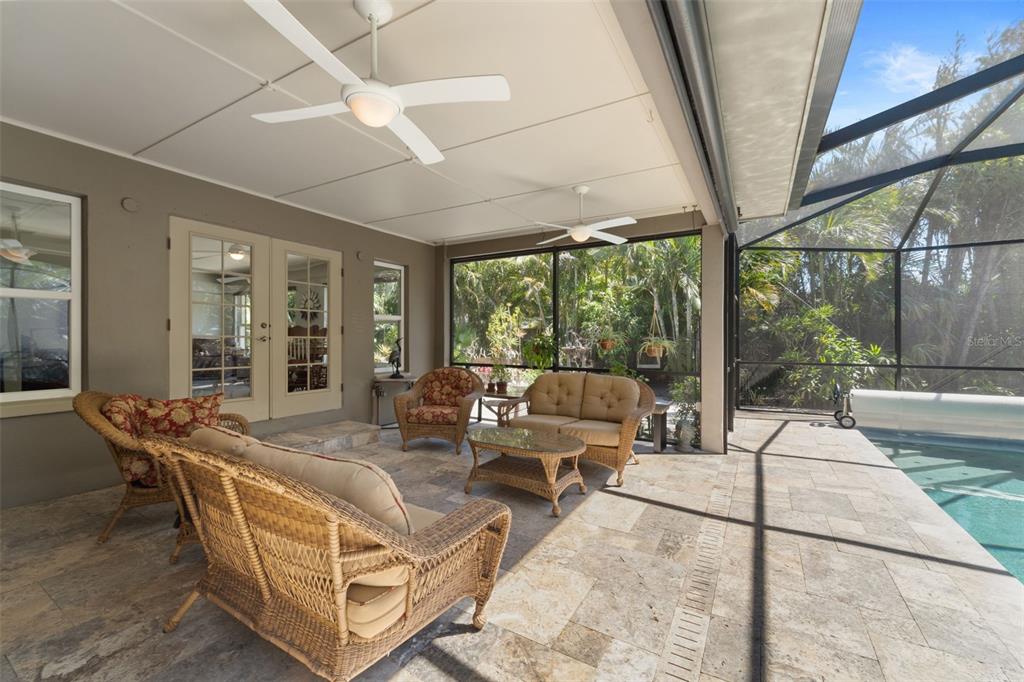 2814 47th Street South Gulfport, FL 33711 - Photo 40 of 57 a living room with patio furniture and a floor to ceiling window