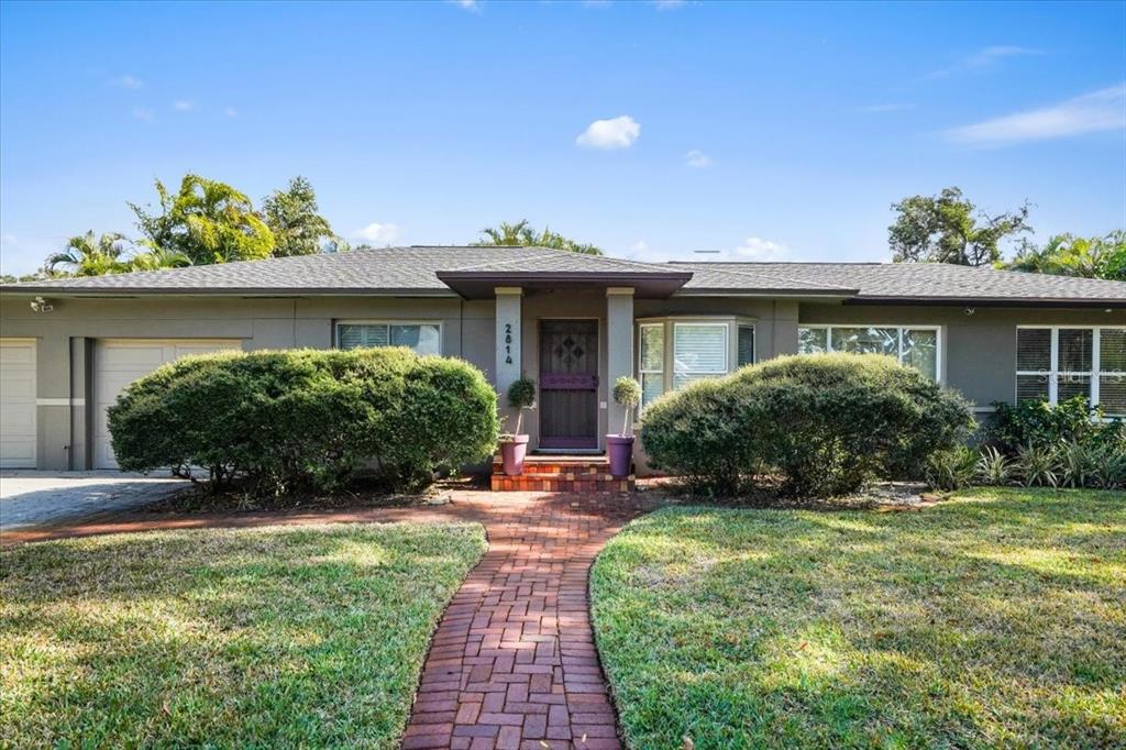 2814 47th Street South Gulfport, FL 33711 - Photo 50 of 57 a front view of a house with a yard