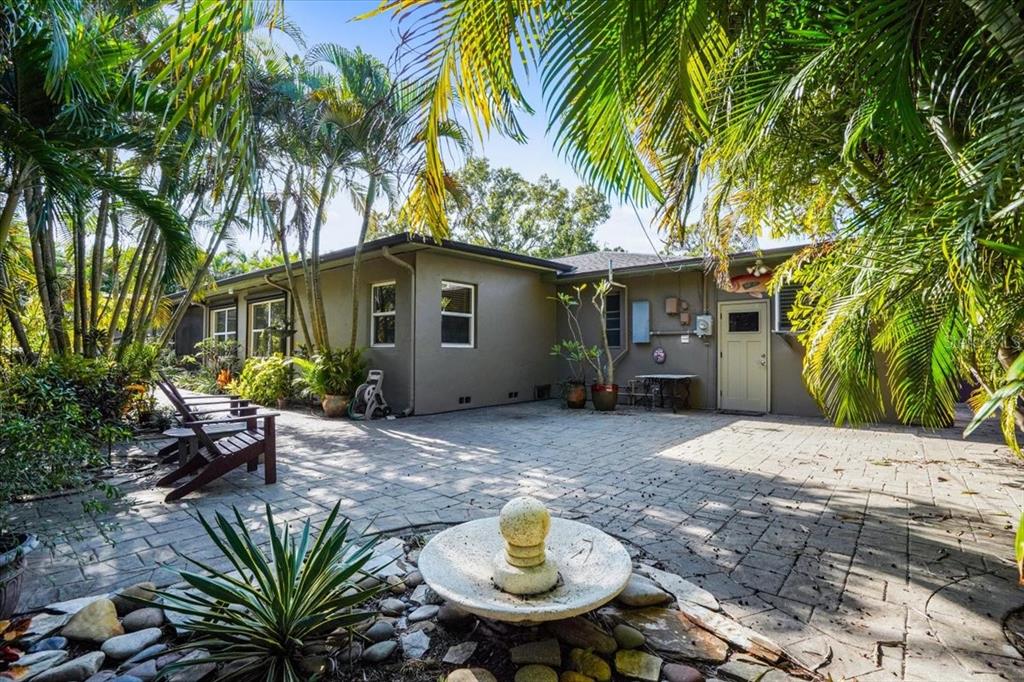 2814 47th Street South Gulfport, FL 33711 - Photo 56 of 57 a backyard of a house with table and chairs