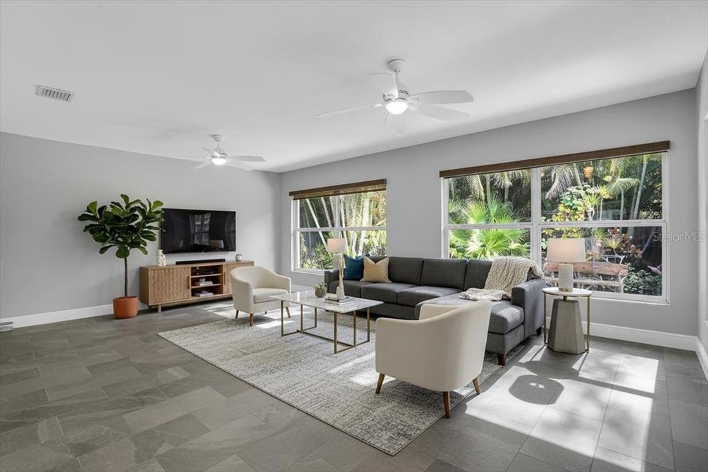 2814 47th Street South Gulfport, FL 33711 - Photo 6 of 57 a living room with fireplace furniture and a large window
