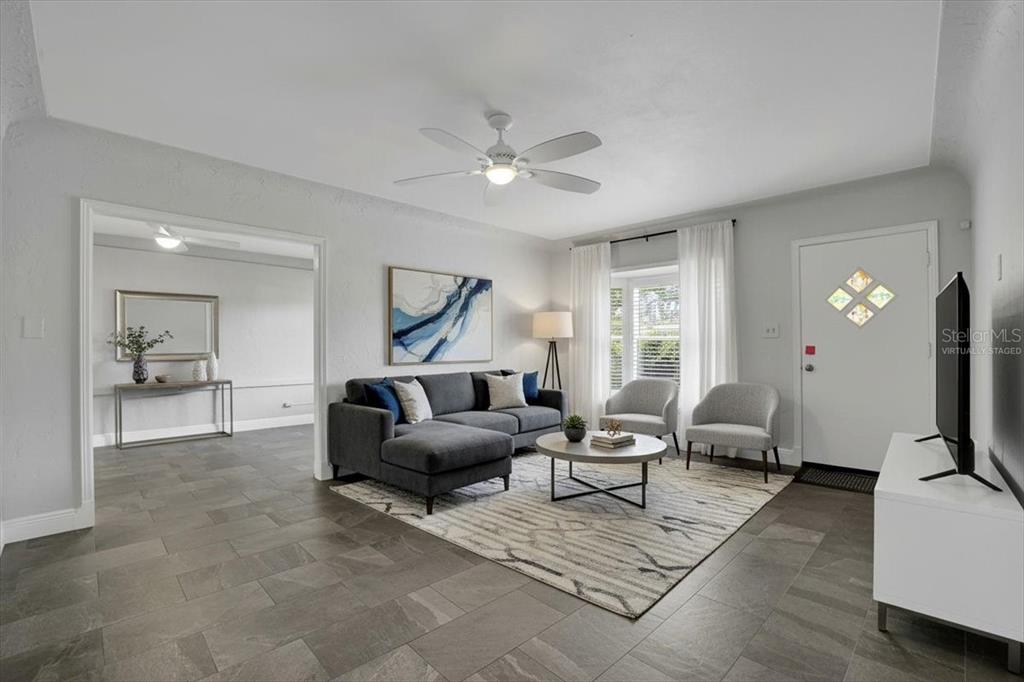 2814 47th Street South Gulfport, FL 33711 - Photo 7 of 57 a living room with furniture and a flat screen tv