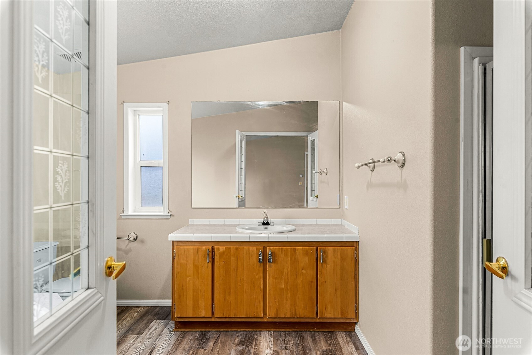 3570 Pinnacle Place Wenatchee, WA 98801 - Photo 21 of 35 a bathroom with a granite countertop sink a mirror and a