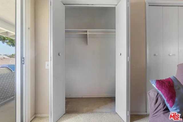 a view of an empty walk in closet