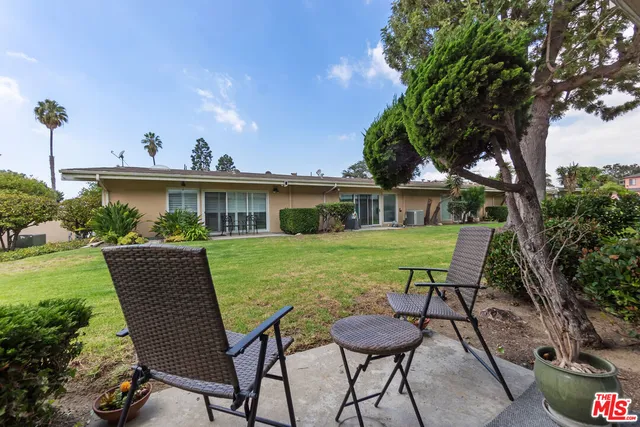 front view of a house with a garden