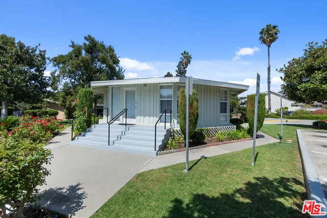 a view of swimming pool with a yard and outdoor seating