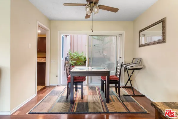 a view of a dining room with furniture window and wooden floor