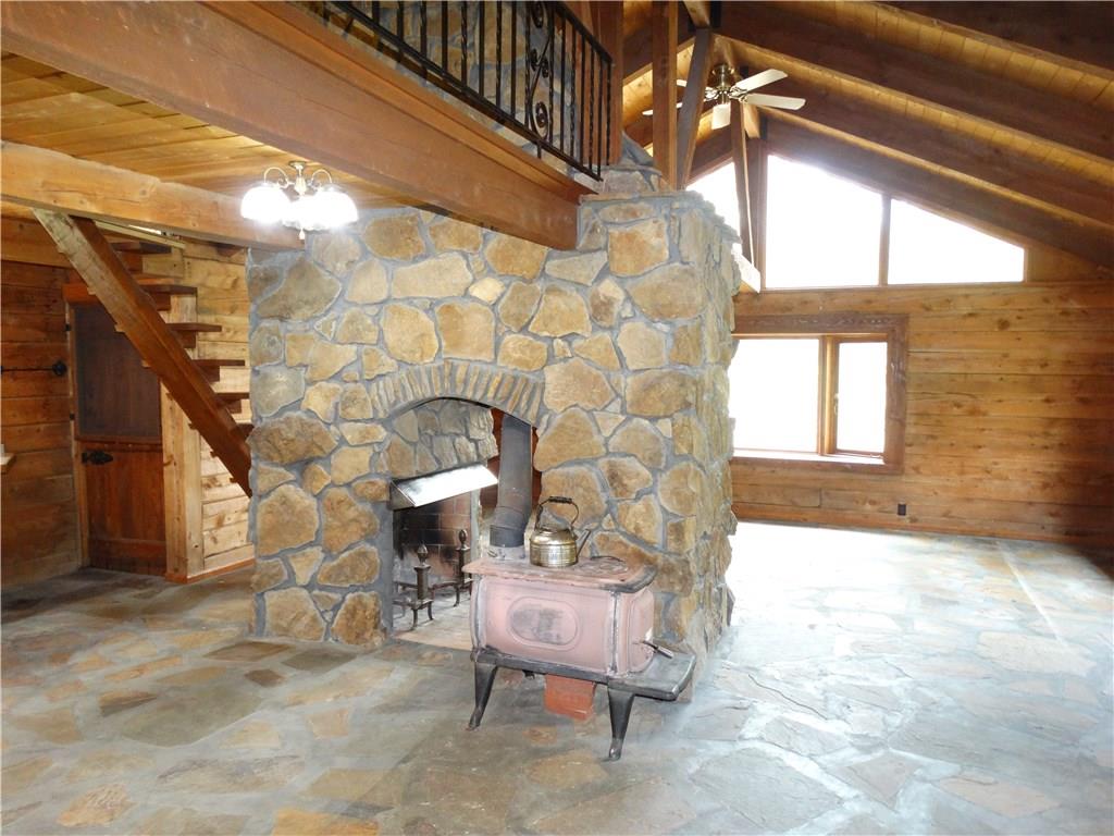 132 Christy Road Saxonburg, PA 16056 - Photo 3 of 23 Unique stone fireplace open to both kitchen and living room with working wood burner