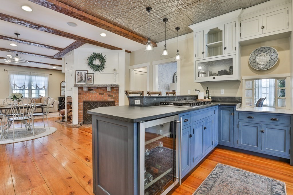 339 Stow Road Harvard, MA 01451 - Photo 11 of 40 a kitchen with stainless steel appliances granite countertop a stove a sink dishwasher and cabinets with wooden floor