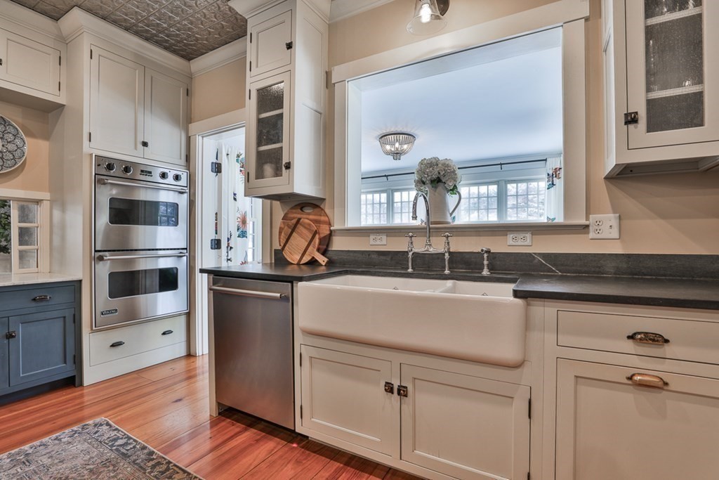 339 Stow Road Harvard, MA 01451 - Photo 12 of 40 a kitchen with stainless steel appliances granite countertop a sink and cabinets
