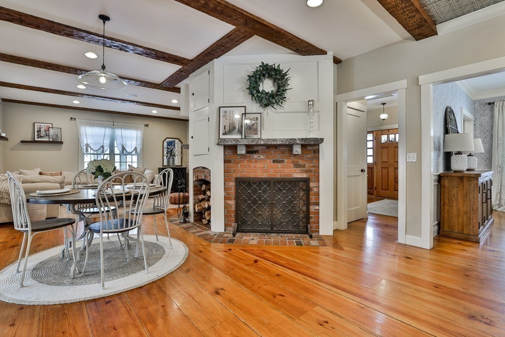 339 Stow Road Harvard, MA 01451 - Photo 16 of 40 a living room with fireplace furniture and a wooden floor