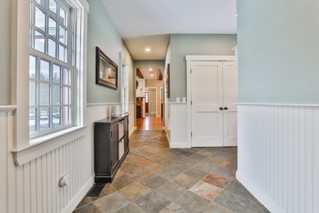 339 Stow Road Harvard, MA 01451 - Photo 21 of 40 a view of a hallway with wooden floor and entryway