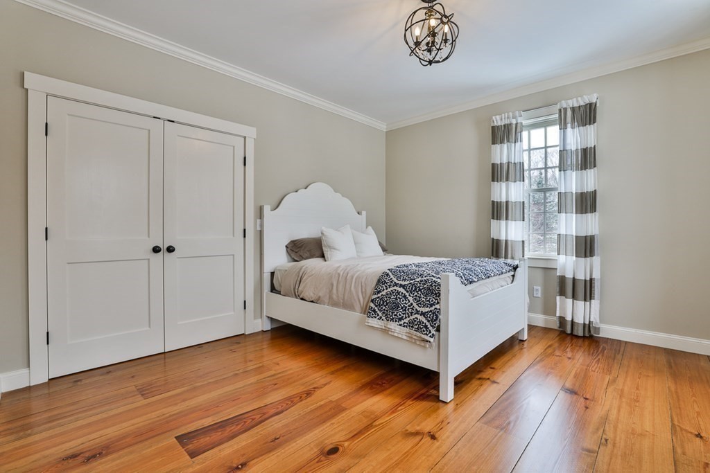 339 Stow Road Harvard, MA 01451 - Photo 27 of 40 a bedroom with a bed and a window