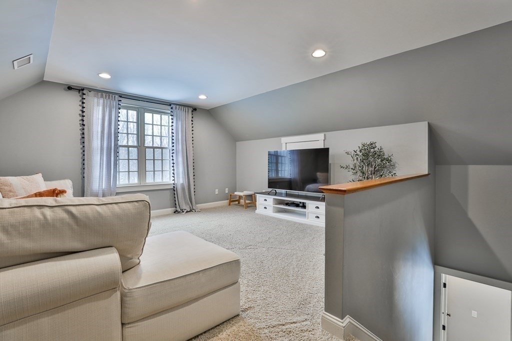 339 Stow Road Harvard, MA 01451 - Photo 32 of 40 a living room with furniture and a flat screen tv