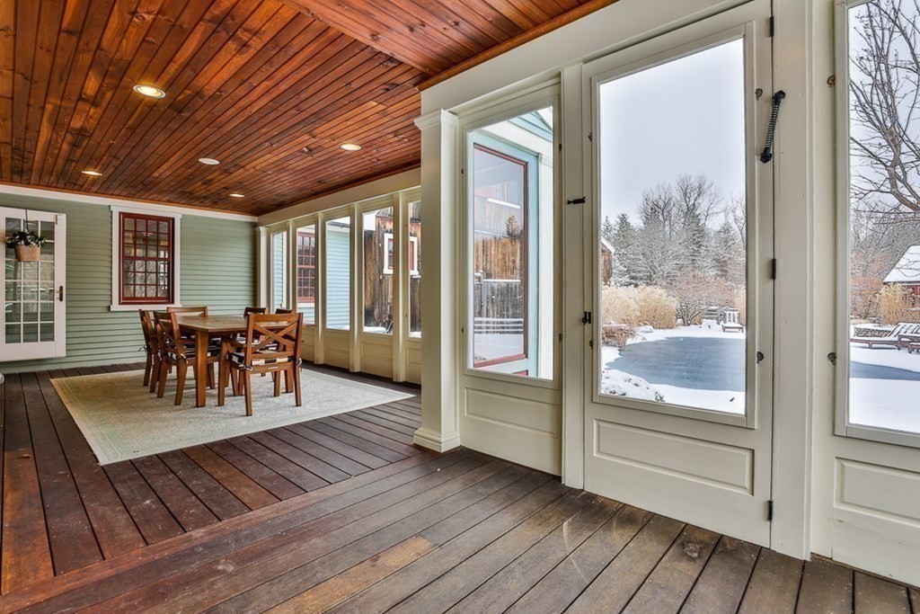 339 Stow Road Harvard, MA 01451 - Photo 38 of 40 a view of a dining room with furniture wooden floor and chandelier