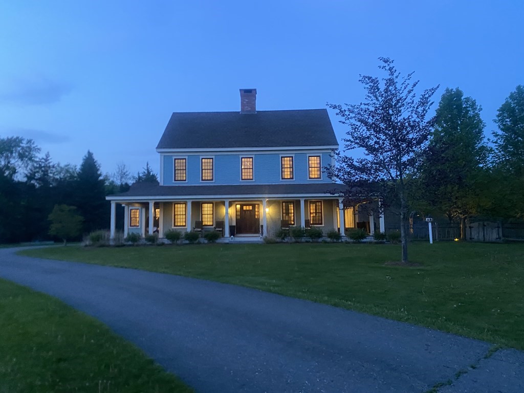 339 Stow Road Harvard, MA 01451 - Photo 39 of 40 a front view of a house with a garden