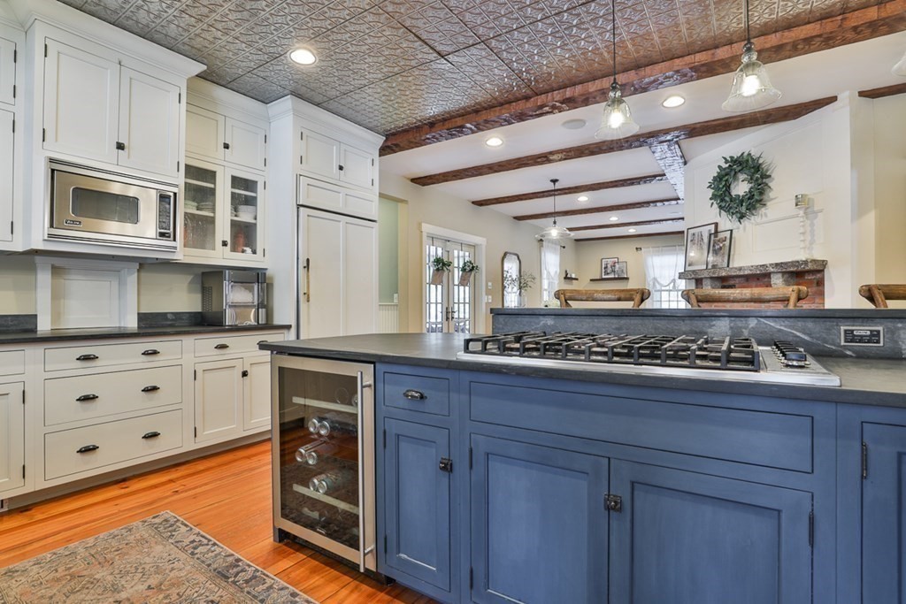 339 Stow Road Harvard, MA 01451 - Photo 10 of 40 a kitchen with stainless steel appliances granite countertop a stove and a sink