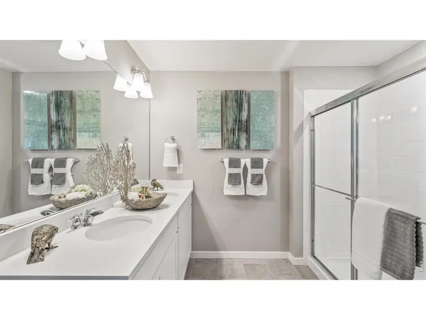 a bathroom with a sink a mirror and a bathtub