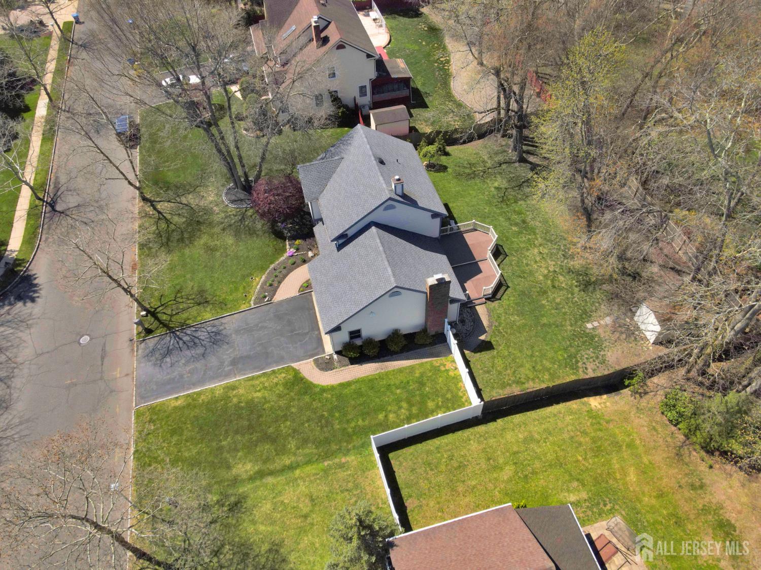 27 Oakland Road Old Bridge, NJ 08857 - Photo 11 of 39 an aerial view of a house with swimming pool and large trees