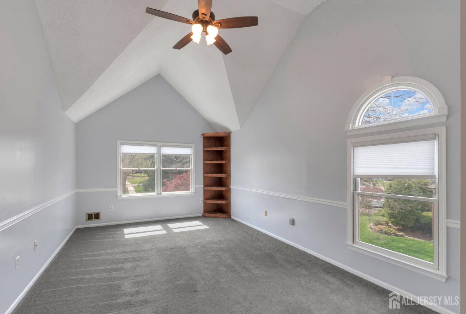 27 Oakland Road Old Bridge, NJ 08857 - Photo 18 of 39 an empty room with a window and ceiling fan