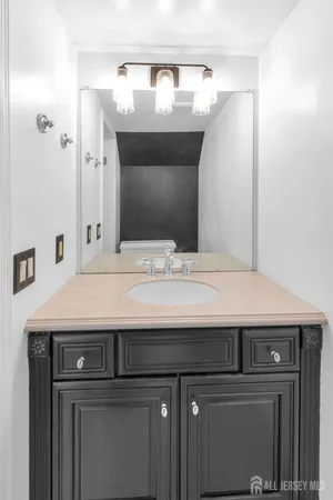 a kitchen with stainless steel appliances a sink stove and cabinets