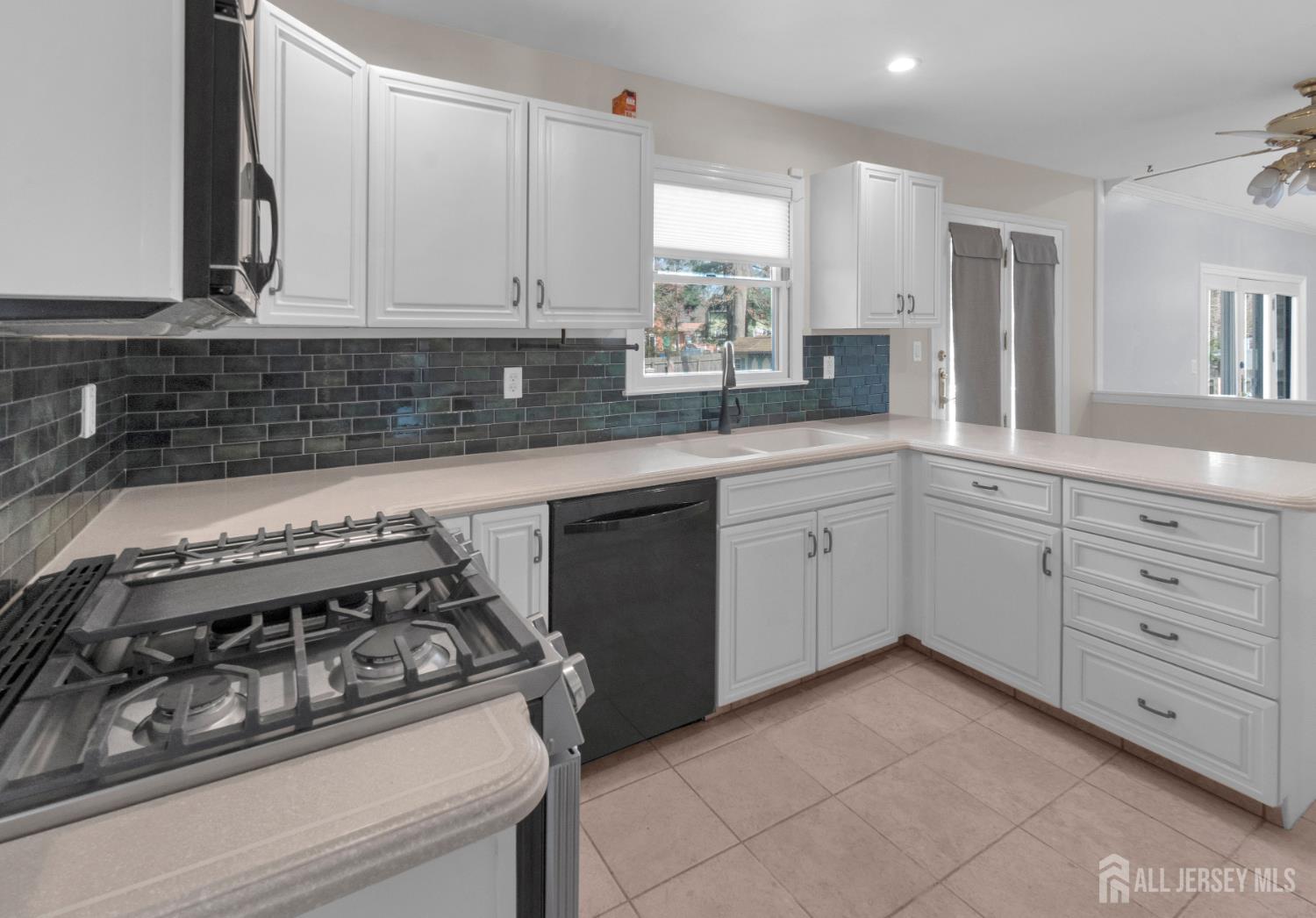 27 Oakland Road Old Bridge, NJ 08857 - Photo 23 of 39 a white kitchen with sink and cabinets