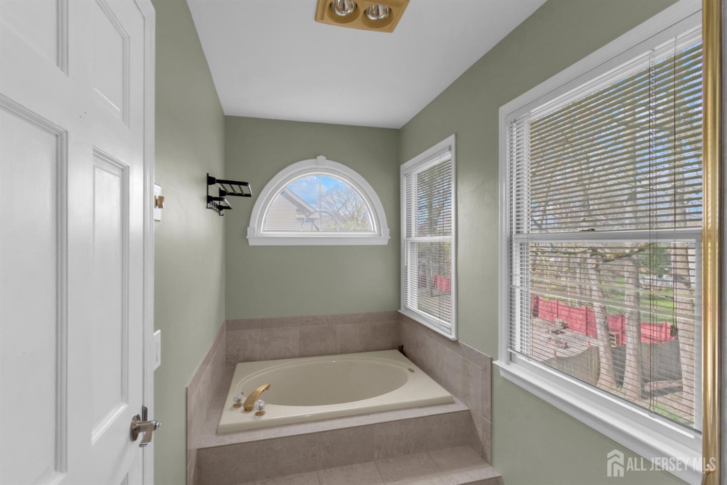 27 Oakland Road Old Bridge, NJ 08857 - Photo 27 of 39 a bathroom with a bathtub and a shower