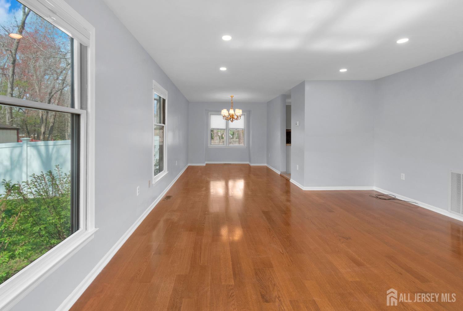 27 Oakland Road Old Bridge, NJ 08857 - Photo 38 of 39 a view of a hallway with wooden floor and a porch