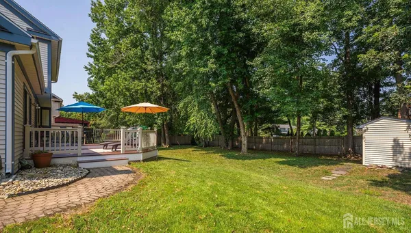 an aerial view of a house with garden space and street view