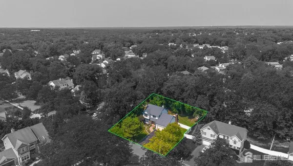 an empty room with a window and ceiling fan