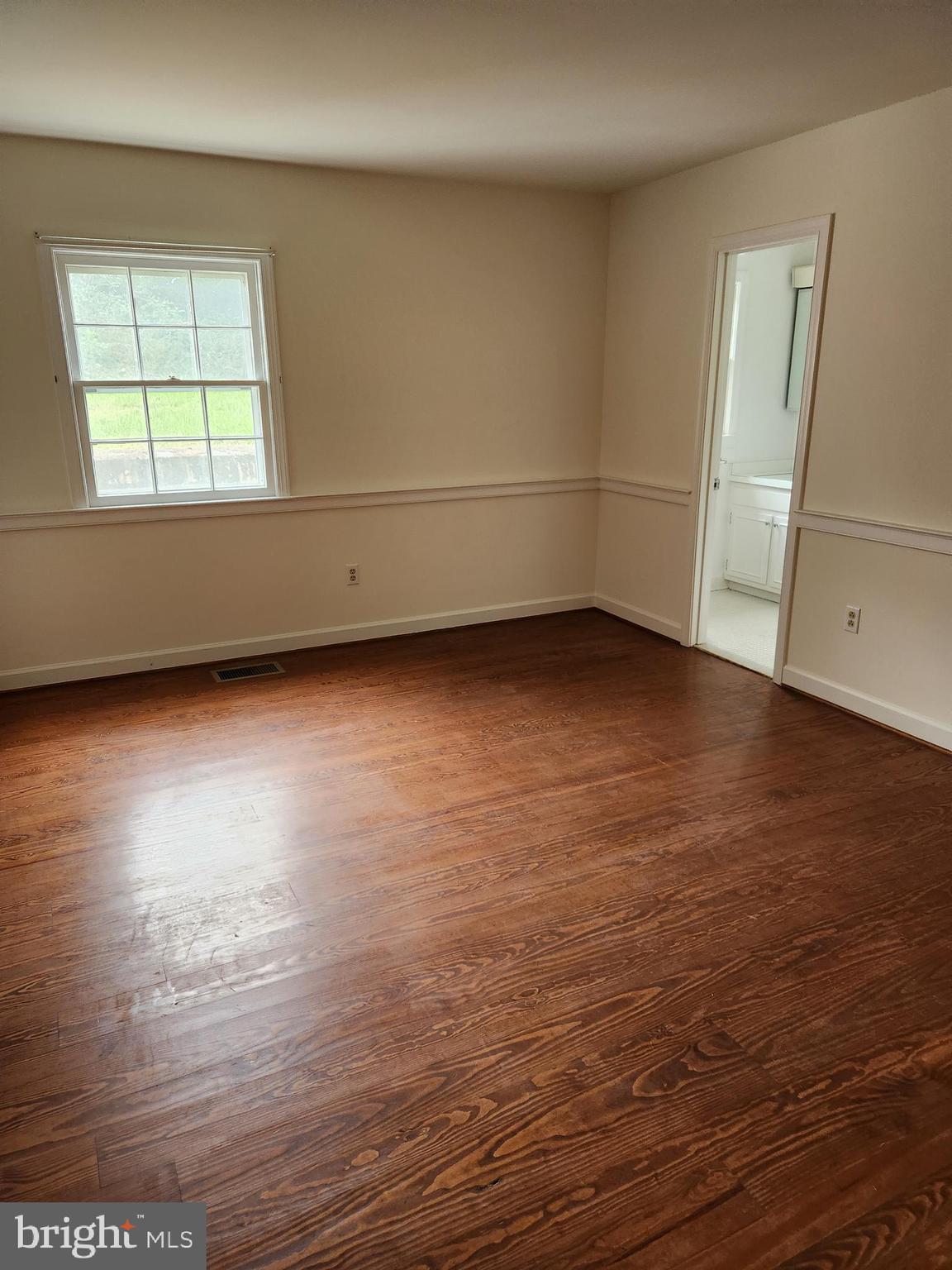 2000 Rectortown Road Delaplane, VA 20144 - Photo 11 of 16 an empty room with wooden floor and windows