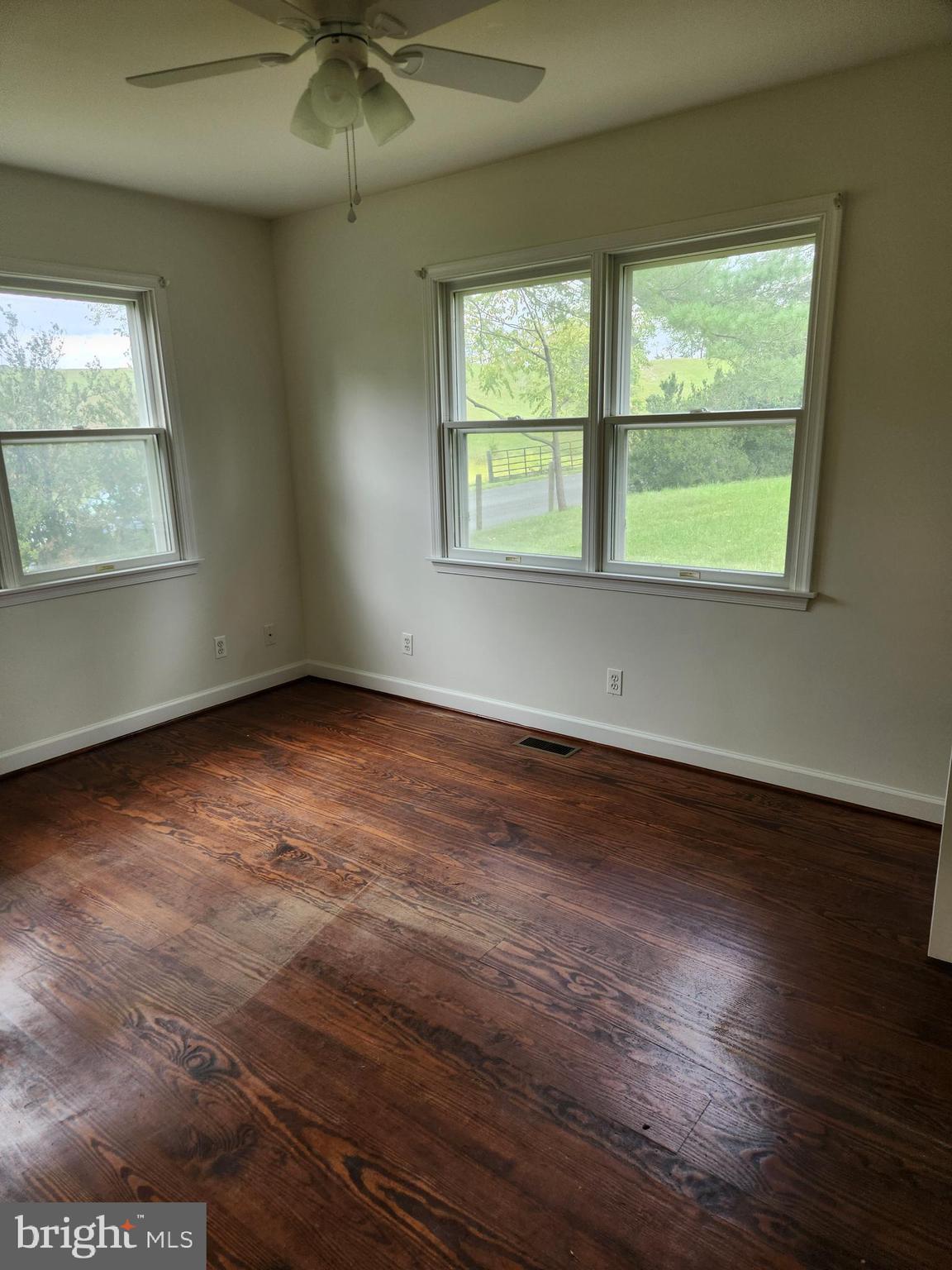 2000 Rectortown Road Delaplane, VA 20144 - Photo 14 of 16 an empty room with wooden floor and windows