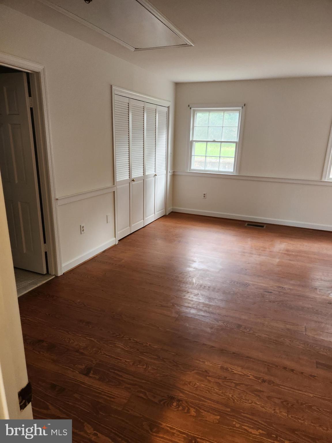 2000 Rectortown Road Delaplane, VA 20144 - Photo 9 of 16 an empty room with wooden floor and windows
