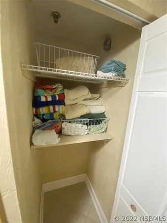 a spacious bedroom with a bed and window