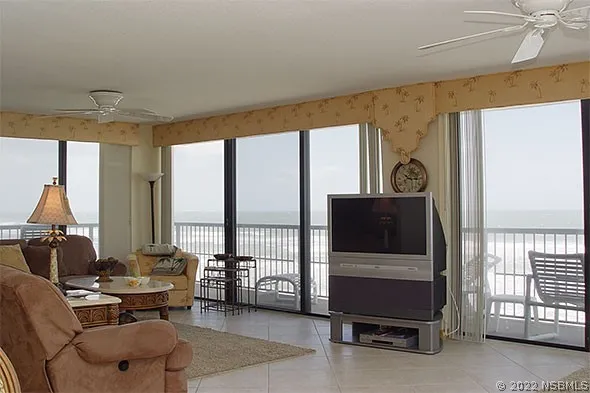 a bedroom with a bed and a night stand