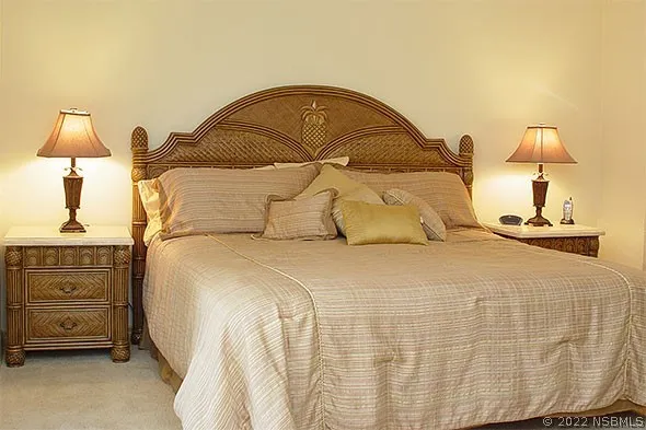 a front view of a multi story building with yard