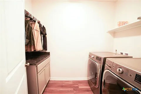 a utility room with dryer and washer