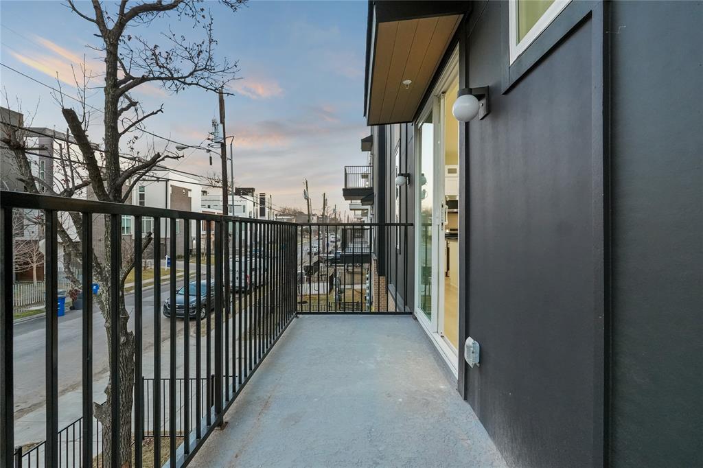 2031 North Prairie Avenue, Unit 101 Dallas, TX 75204 - Photo 13 of 23 View of balcony at dusk