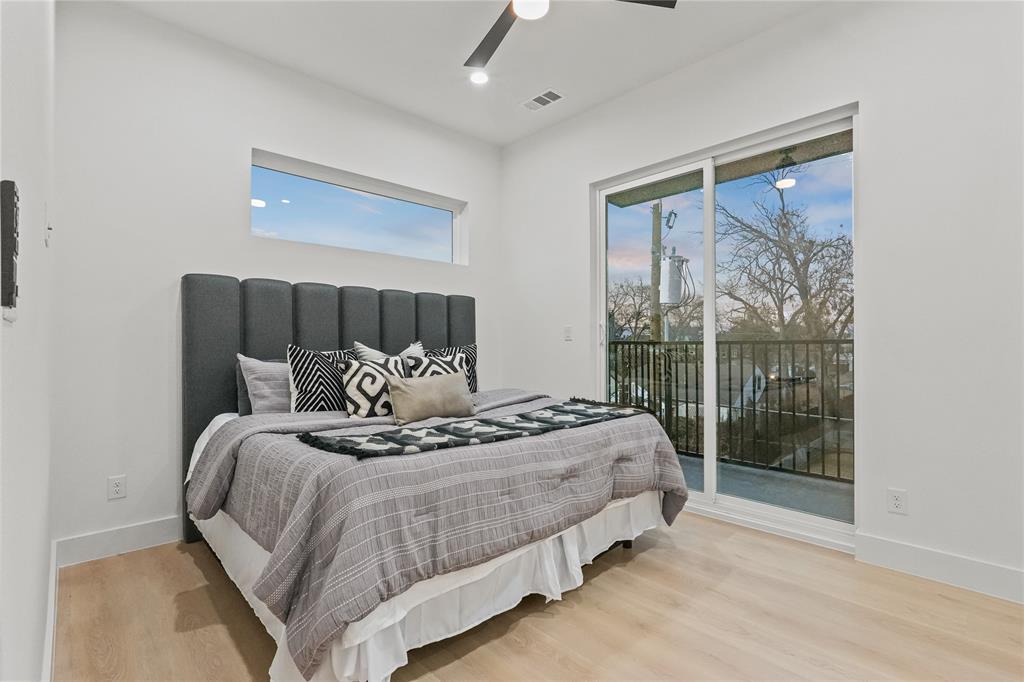 2031 North Prairie Avenue, Unit 101 Dallas, TX 75204 - Photo 16 of 23 Bedroom featuring light wood finished floors, access to outside, and a ceiling fan