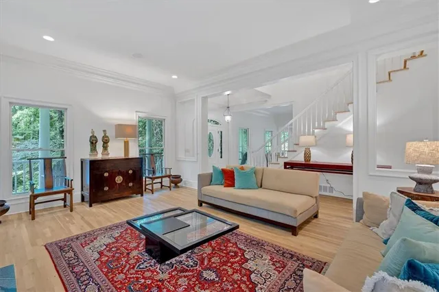 a bedroom with furniture and a flat screen tv