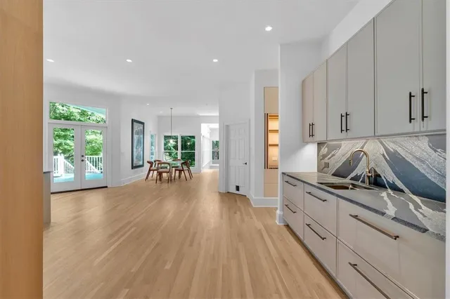 a bedroom with a bed and glass windows