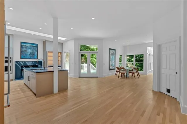 a spacious bathroom with a sink mirror and shower