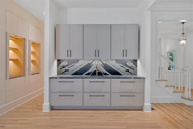 a view of a pathway both side of house