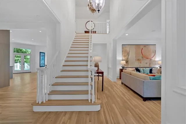a view of a kitchen with furniture and wooden floor